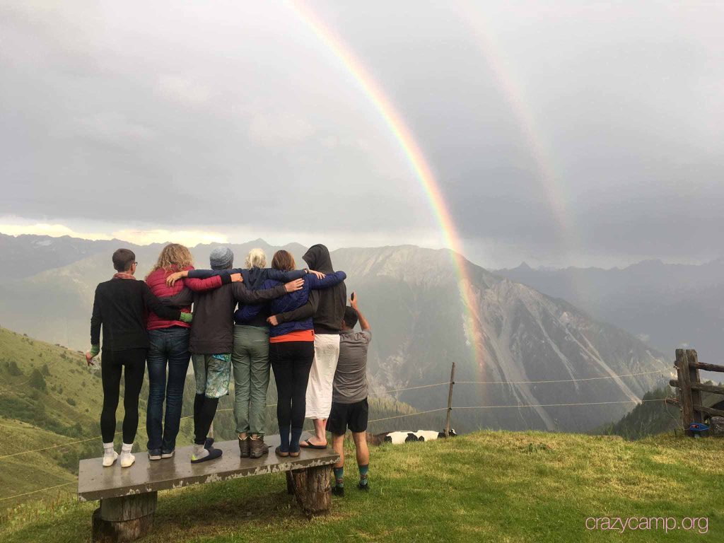 Hiking group watching rainbows together