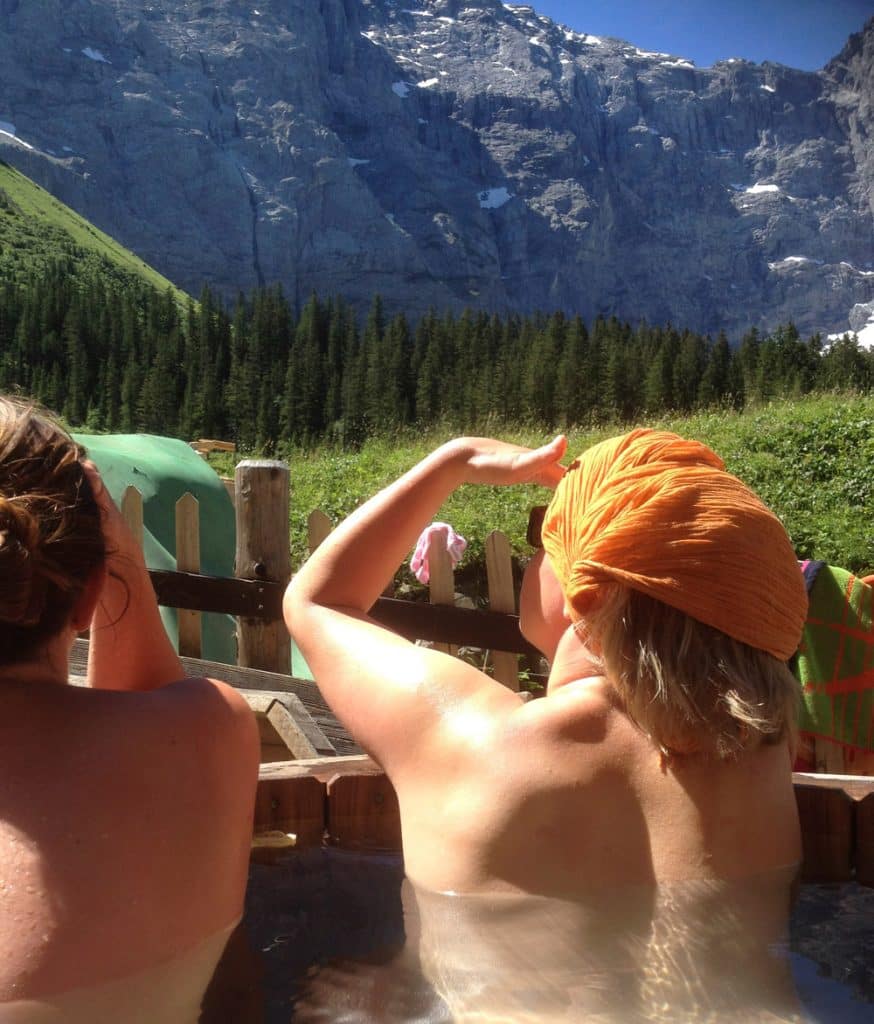 Two women relaxing in the hot tub after a day of hiking